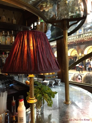 The beautiful burgundy lampshades in Cafe Boheme Soho