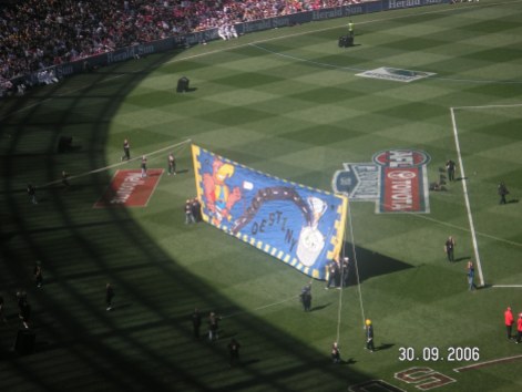 The footy banner that the players run through at the start of the game