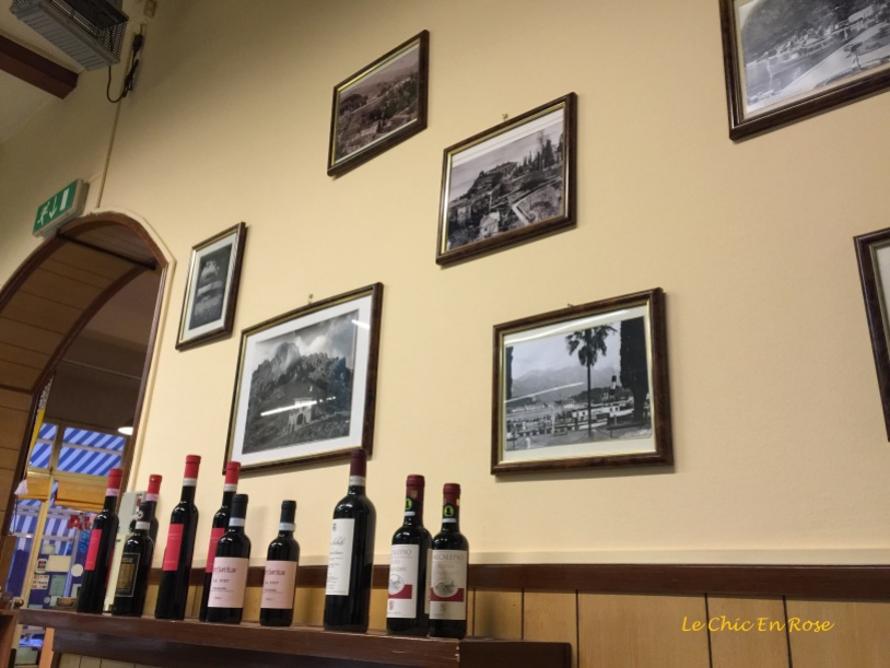 Old Framed Photos Of Menaggio Line the Wall