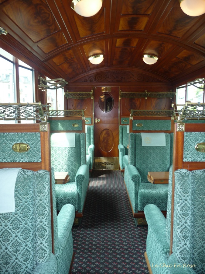Plush green seats and wooden ceilings