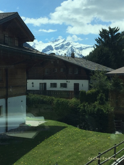 Chalets and glimpses of the high alpine peaks at Gstaad